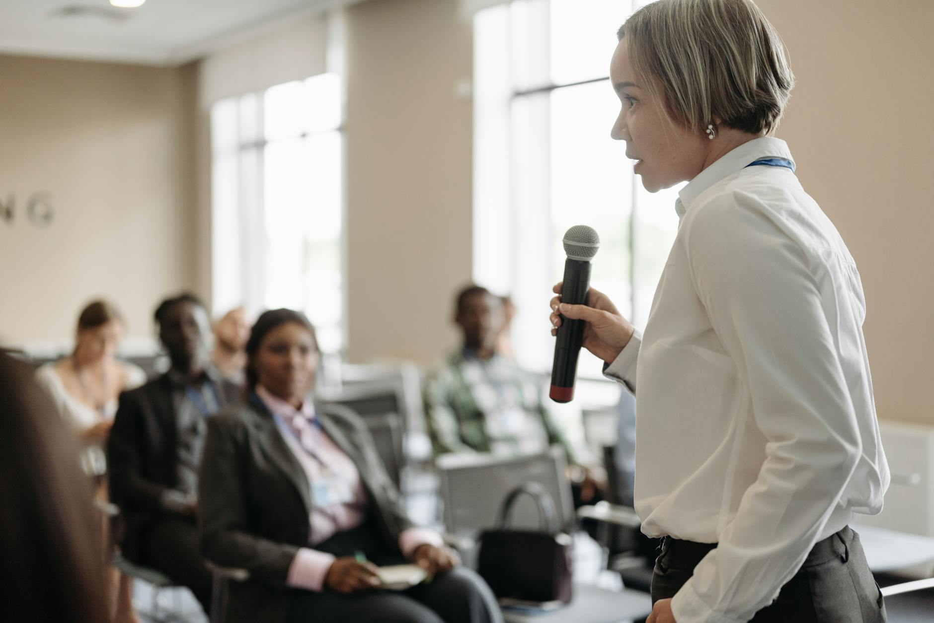 Person speaking into microphone